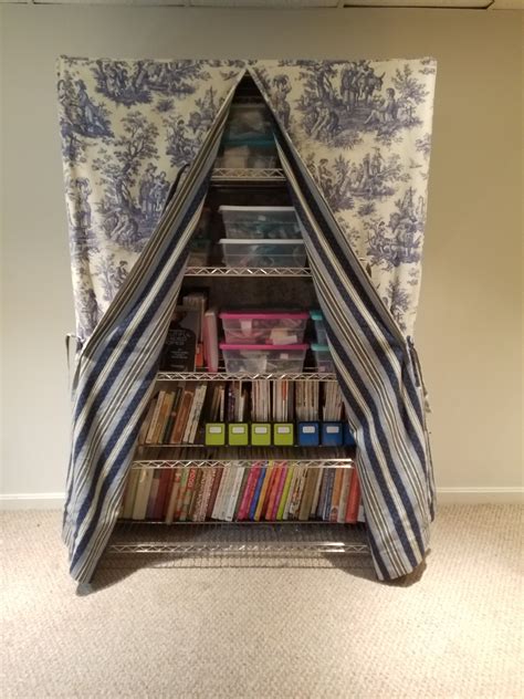 how to disguise metal shelving with fabric|how to hide clutter in shelves.